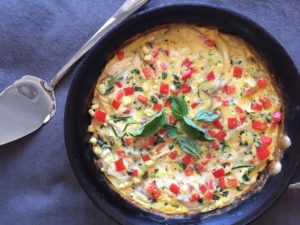 Chicken-basil vegetable frittata with zucchini, bell peppers, and sweet summer corn