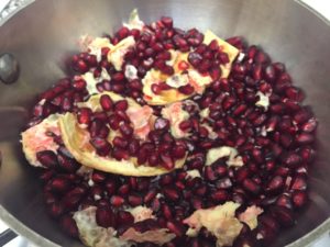 Mostly pomegranate arils, with some pith, membrane, and peel